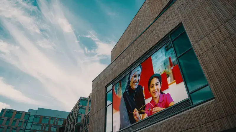 A digital signage on a huge corporate building