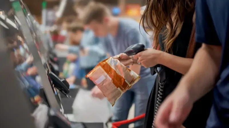 People using self service checkout