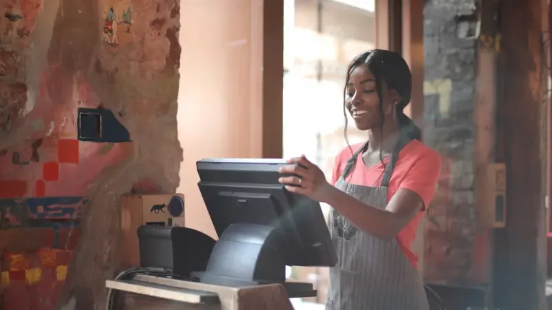 Young female working on cash register