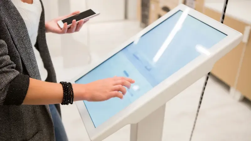 an individual using a kiosk