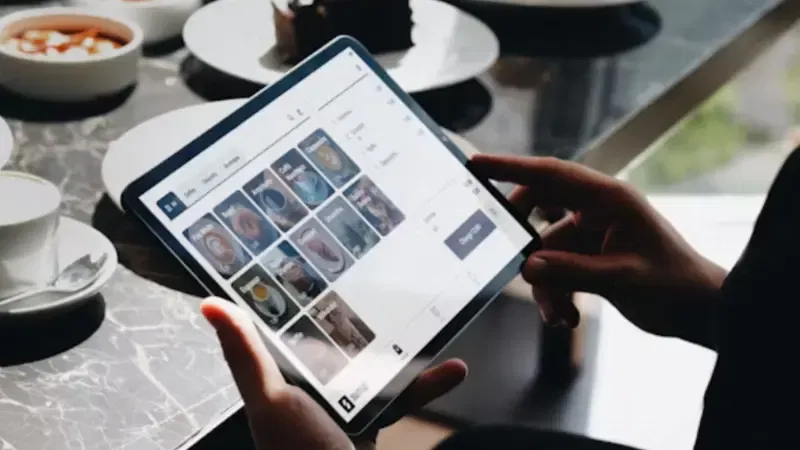 A customer using POS software to place an order