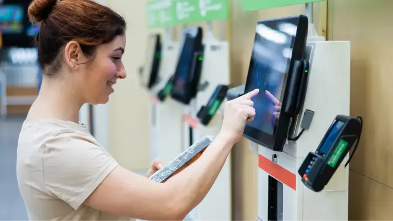 A customer using a self-service kiosk