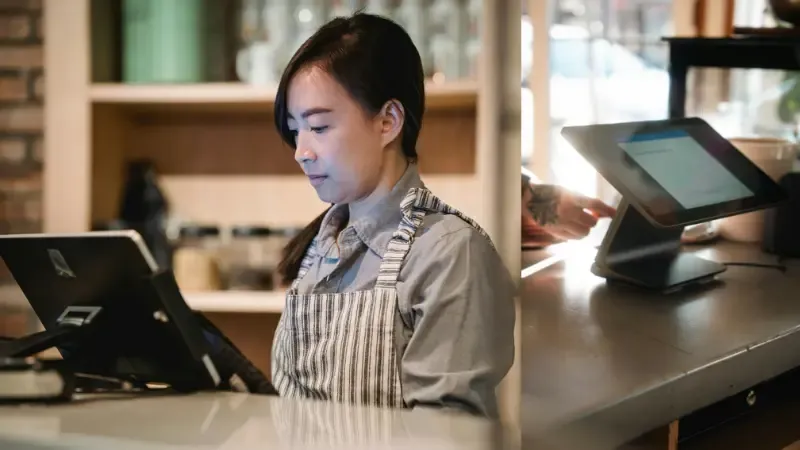 Business owner using POS cash register