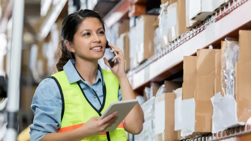 Distribution warehouse manager talks with supplier