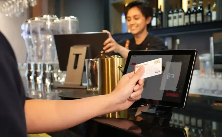 a customer paying at the POS through a card