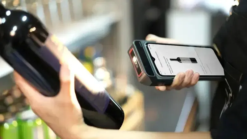 a person scanning a product using RFID tech