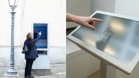 A Woman Using Interactive Digital Kiosk