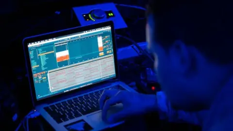 a tech guy using a laptop