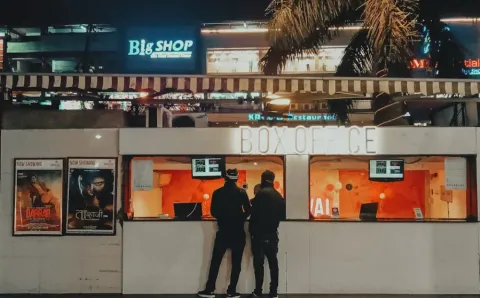 people buying movie tickets from the box office_swiftforce